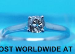 An 18ct white gold ring set with an old cut diamond measuring approximately 0.