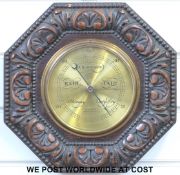 Aitchinson octagonal oak-cased carved barometer