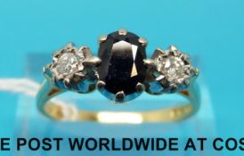An 18ct gold ring set with sapphires and diamonds (size R)