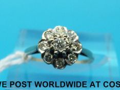 A 9ct gold ring set with diamonds in a cluster (size J)