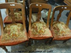 Four oak framed dining chairs