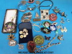 A quantity of silver jewellery to include bangles, brooches, bracelets,