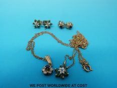 A 9ct gold necklace set with emeralds and diamonds and a 9ct gold necklace set with blue and clear