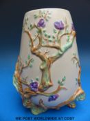 A Clarice Cliff relief moulded Indian Tree conical jug (shape no 989) with Newport Pottery stamp to