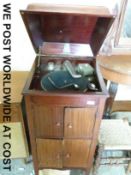A Triphonic wind up (home type) gramophone together with a selection of 78rpm records