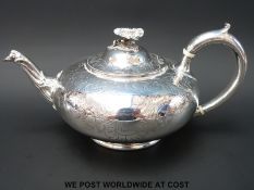 A Victorian hallmarked silver teapot of squat design,