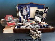 A collection of silver plated and other metal ware to include silver handled knives,