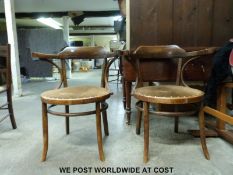 A pair of 1920's bentwood carver chairs with padded seats