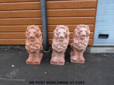 Three teracotta lions.