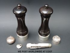 A pair of silver mounted salt and pepper grinders (height 15cm), pill box marked 925,