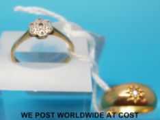An 18ct gold ring set with diamonds in a platinum flower cluster and an 18ct gold ring set with a