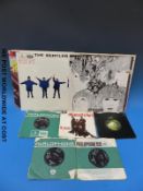 Four original Beatles LPs on the black & yellow Parlophone label: “With The Beatles”;