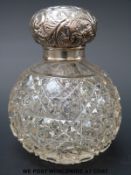 A hallmarked silver hobnail cut glass dressing table bottle (height 10cm)