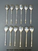 Twelve (nine plus three) Russian gilt and Niello spoons with townscapes to backs,