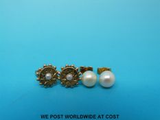 A pair of pearl studs and a pair of yellow metal and pearl earrings.