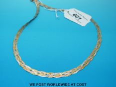 A 9ct gold tri-coloured plaited necklace (6.