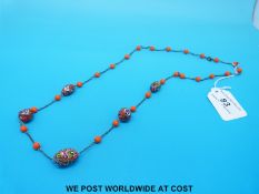 A glass beaded necklace with five millefiori glass beads.