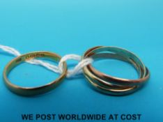 A 22ct gold wedding band (2.3g) and a 9ct gold Russian style tri-coloured wedding band (2.