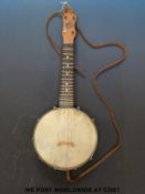 A banjo ukulele by John Grem & Sons,