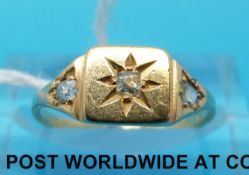 A yellow metal ring set with three diamonds (size I)