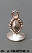 An unusual 18thC cut steel fob with musical bar, heart and 'De Mon' seal,