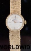 Omega 9ct gold ladies wristwatch with two tone hands and baton markers,