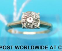 A yellow metal ring marked 14ct set with diamonds (size N)
