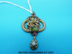 An Austro- Hungarian pendant depicting George and the dragon set with emeralds, moonstone,