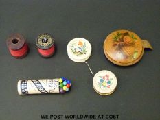 Two 19thC carved bone hand decorated cotton spools, one with 'A Gift From a Friend',