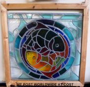 A pine framed stained glass window with Ying & Yang fish decoration made by Lorraine Crocker of