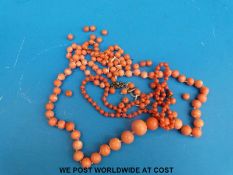 Three coral necklaces.