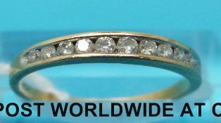 A 9ct gold half eternity ring set with diamonds (size N)