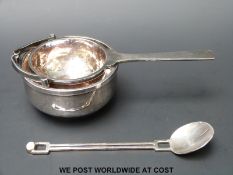 An Arts & Crafts style hallmarked silver hammered strainer and bowl, London 1972,
