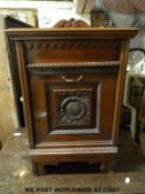 A 19thC carved mahogany purdonium with brass tongs