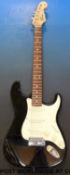 A Squire Strat electric guitar by Fender,