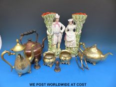 A pair of Staffordshire figural spill vases,