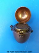 A copper and gilt sovereign case formed as an egg