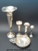Three hallmarked silver bud vases and a large unmarked example with rubbed marks,
