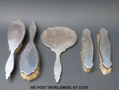 A cased hallmarked silver five piece dressing table set