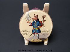 A late 19th / 20thC pin cushion with decorated glass plaque ' A piece of antiquity painted on the