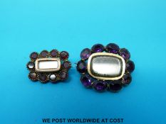 A yellow metal brooch set with hair to the centre surrounded by amethysts together with a smaller