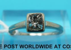 An 18ct white gold ring set with a princess cut diamond of approximately 0.