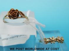 Two 9ct gold rings, one in the form of a rose and the other five daisies (3.