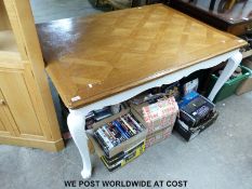 An oak parquetry topped dining table with painted base (139 x 100cm)