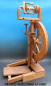 An Ashford spinning wheel together with a collection of books on the subject