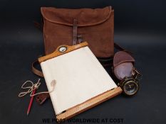 A leather cased WWI (1918) marching compass together with an Aston & Mander 1909 map board in