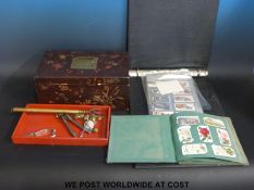 A Japanese lacquer box and various items inc a toasting fork and cigarette cards.