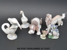 Five Lladro animals comprising two dogs and three geese together with two Wade Tom & Jerry figures