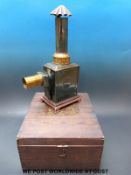 An Ernest Plank magic lantern from 1900 together with box and slides,