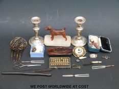 A pair of hallmarked silver candlesticks, carved ivory brooches, ladies items,